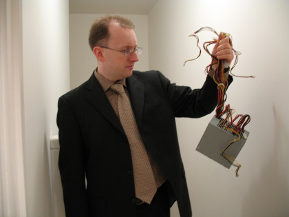 Joel holding power supply looking like intenstines